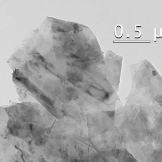Transmission electron micrograph of industrial grade graphene nanoplatelets showing several stacked few-layer thick flakes with irregular edges against a 0.5 micron scale bar, illustrating the 6 to 10 layer thickness range of this grade